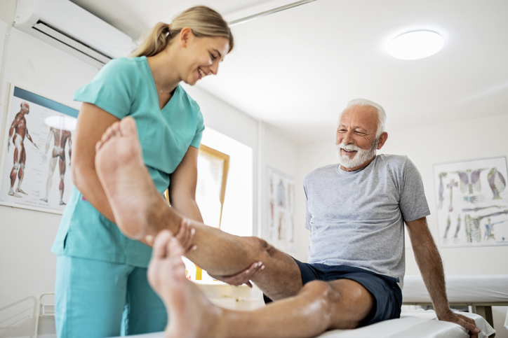 Young-Physiotherapist-with-Senior-Patient